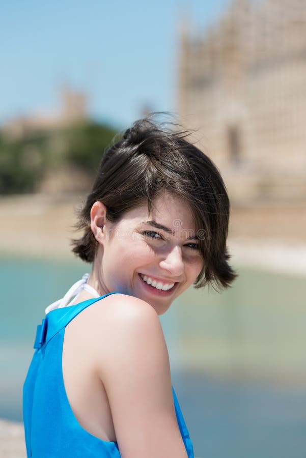 Close up portrait of young attractive smiling woman outdoors. Close up portrait of young attractive smiling woman outdoors