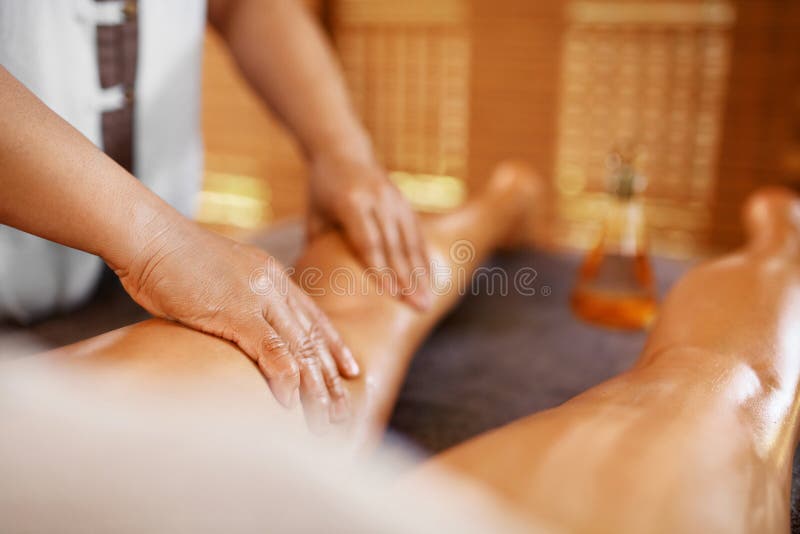 Spa Woman. Aromatherapy Oil Leg Massage Therapy. Masseur Massaging Young Long Female Legs In Cosmetology Salon. Beauty Treatment Concept. Relaxing Body Procedure. Skin Care, Wellness, Lifestyle. Spa Woman. Aromatherapy Oil Leg Massage Therapy. Masseur Massaging Young Long Female Legs In Cosmetology Salon. Beauty Treatment Concept. Relaxing Body Procedure. Skin Care, Wellness, Lifestyle