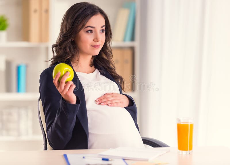 Femme enceinte d'affaires photo libre de droits Femme enceinte d'affaires photo libre de droits