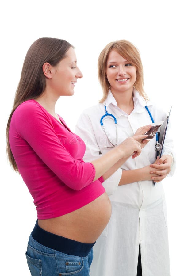 Femme enceinte et une infirmière images stock Femme enceinte et une infirmière images stock