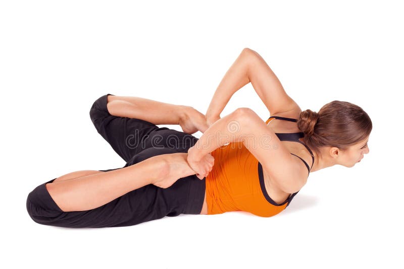 Femme faisant l'exercice de yoga de pose de grenouille image stock Femme faisant l'exercice de yoga de pose de grenouille image stock