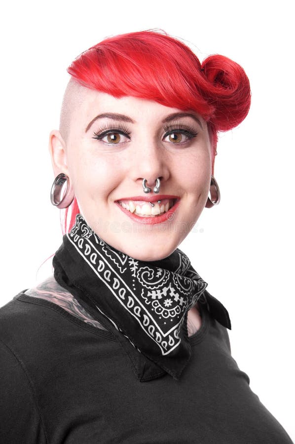 Young woman with facial piercings and tattoos. Young woman with facial piercings and tattoos