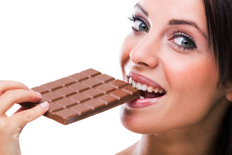 Femme mangeant du chocolat photographie stock Femme mangeant du chocolat photographie stock