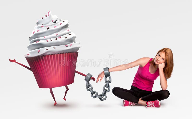 Femme menottée à un petit gâteau images stock Femme menottée à un petit gâteau images stock