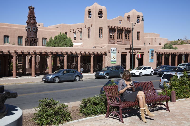 Woman sitting on the bench by Cathedral Place. Woman sitting on the bench by Cathedral Place.