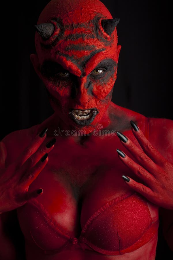 Femme sexy de diable. photo libre de droits Femme sexy de diable. photo libre de droits