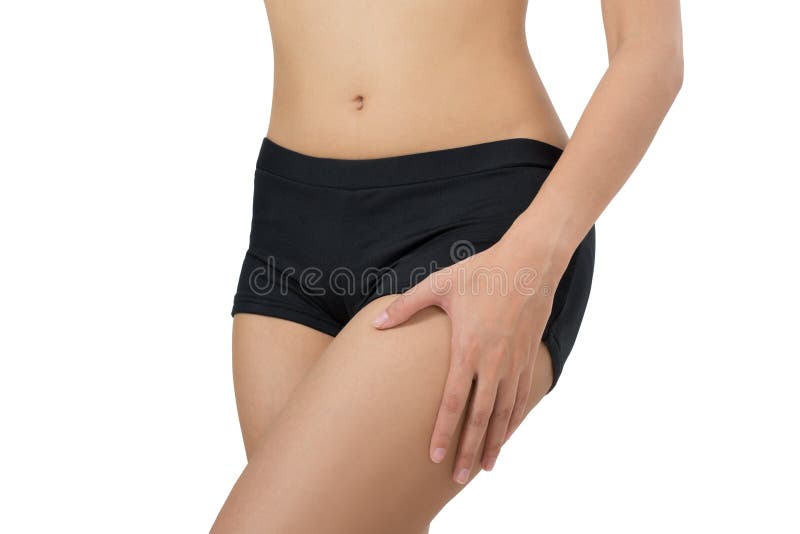Femme tenant son beau corps sain avec masser la cuisse dans le secteur de douleur images stock Femme tenant son beau corps sain avec masser la cuisse dans le secteur de douleur images stock