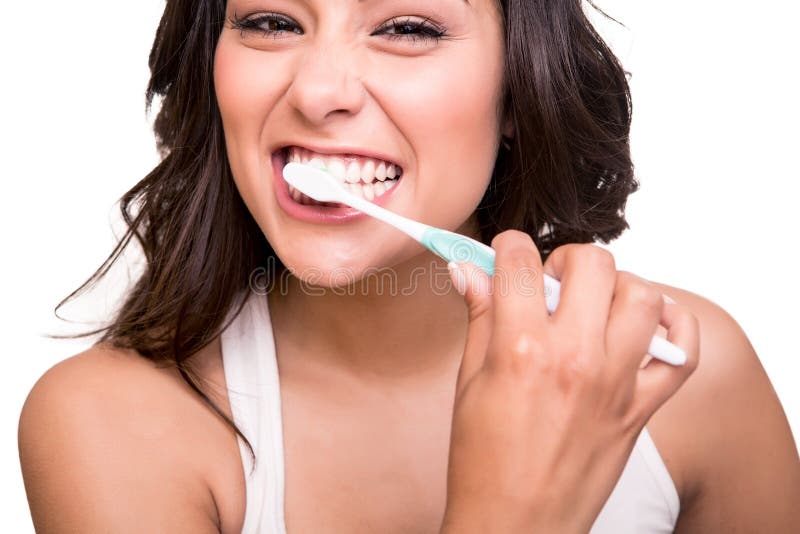 Femme tenant une brosse à dents photographie stock Femme tenant une brosse à dents photographie stock