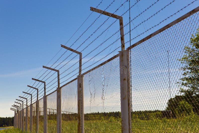 Fence with a barbed wire