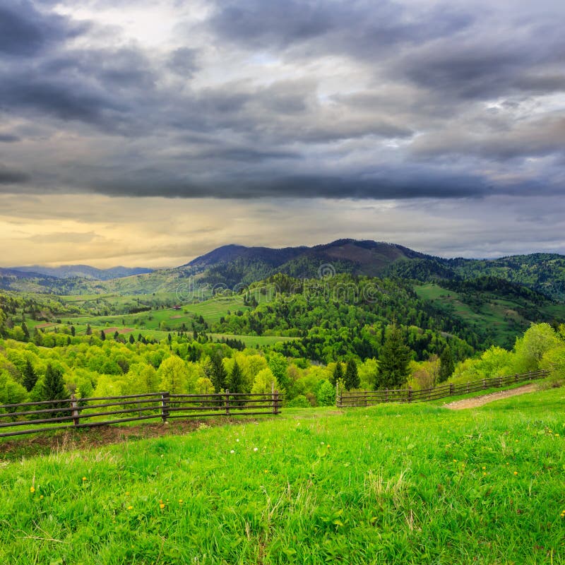 Fence on Hillside Meadow in Mountain at Sunrise Stock Photo - Image of ...