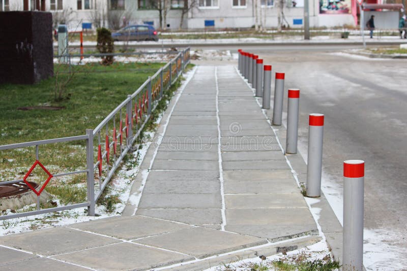 Fencing of the sidewalk from cars several metal posts, antiterrorist protection royalty free stock image