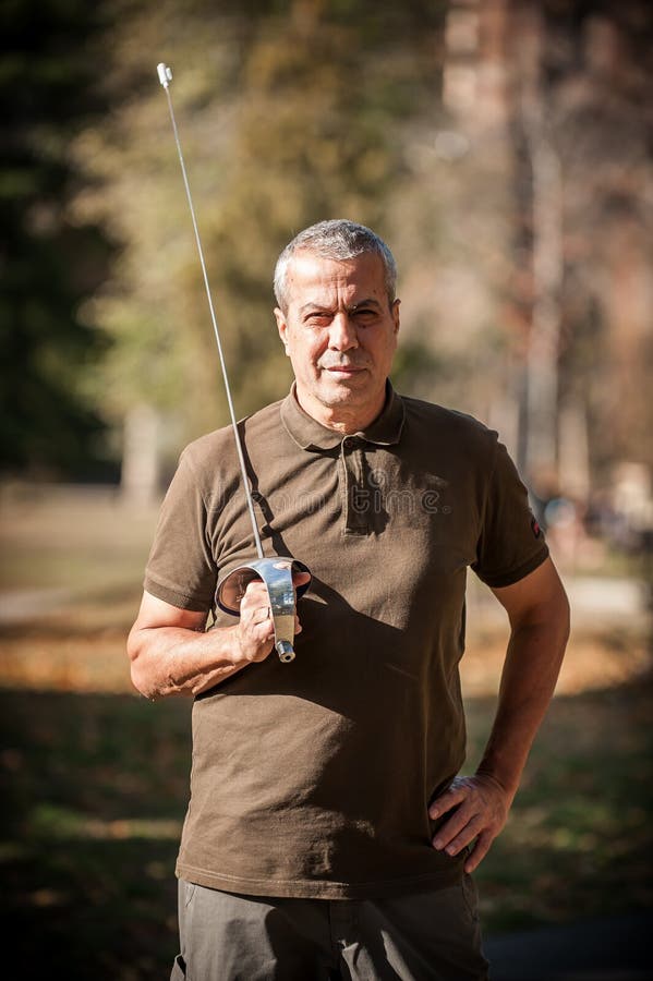Fencing Swordsman Instructor Demonstrates Sword Fighting Techniques and