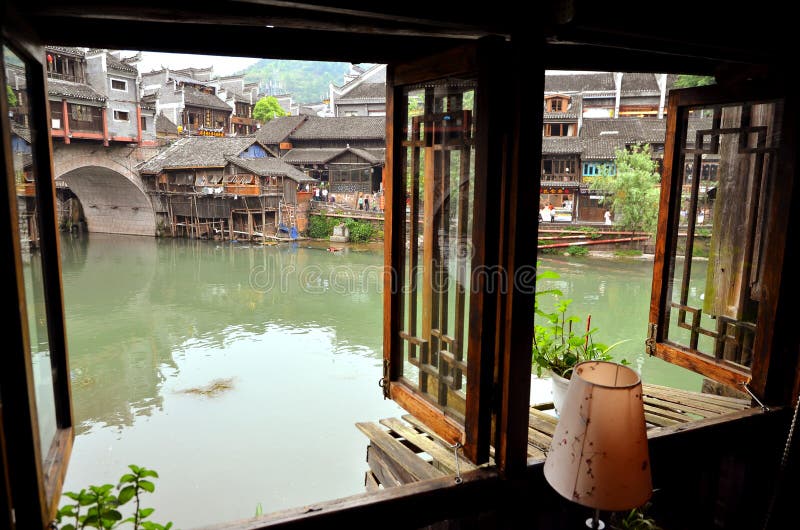 Fenghuang, China - May 14, 2017: View from the window on riiverside at the Phoenix Hong Bridge in Fenghuang stock images Fenghuang, China - May 14, 2017: View from the window on riiverside at the Phoenix Hong Bridge in Fenghuang stock images