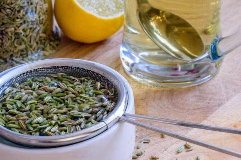 Fennel Seeds Inside Sieve Being Brewed for Healthy Drink Stock Image