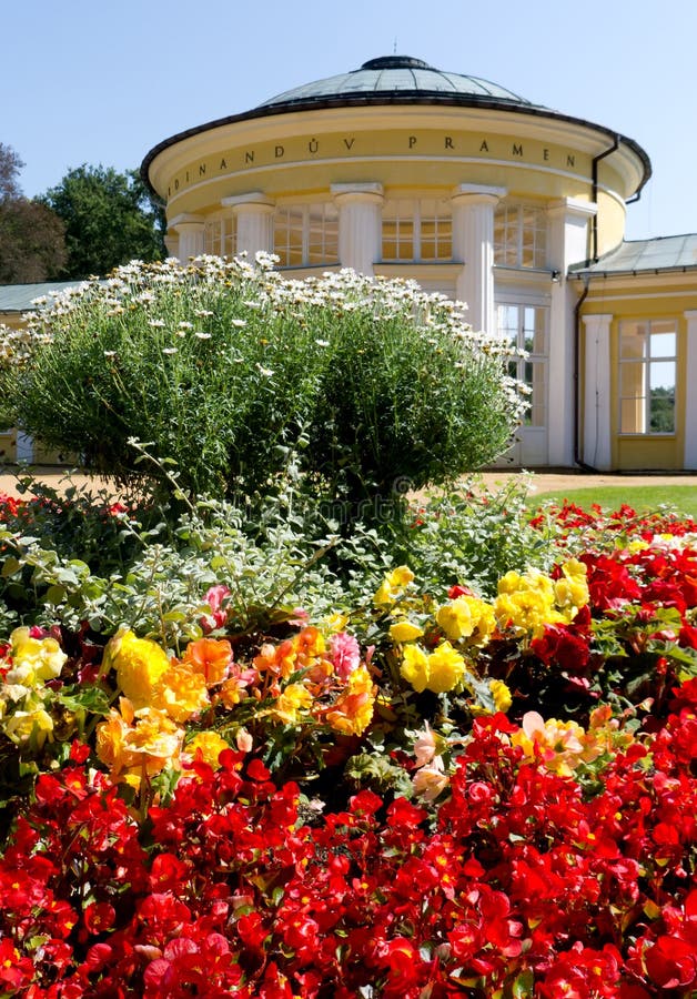 Ferdinand Spring Colonnade, Marianske Lazne Spa. Flowers in Front of Ferdinand Spring Colonnade, Marianske Lazne - Marienbad Spa, Czech Republic royalty free stock photography Ferdinand Spring Colonnade, Marianske Lazne Spa. Flowers in Front of Ferdinand Spring Colonnade, Marianske Lazne - Marienbad Spa, Czech Republic royalty free stock photography