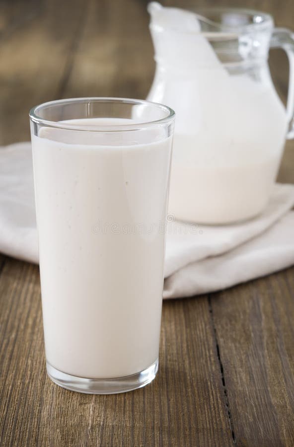 Baked Milk. Texture Background of Baked Milk with a Wooden Spoon. Close