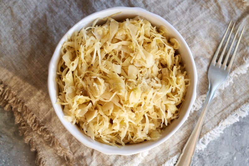 Fermented Cabbage or Sauerkraut in a Bowl with a Fork Stock Image