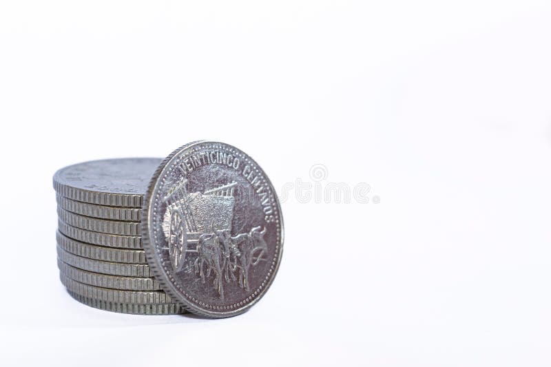 A closeup of a Dominican republic centavos coin on a white background. A closeup of a Dominican republic centavos coin on a white background