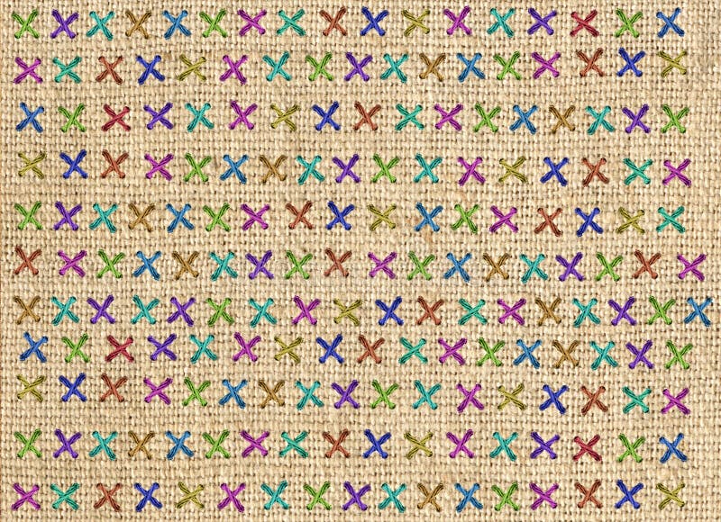 Fermez-vous du détail croisé coloré de point sur le coussin de concepteur photo libre de droits Fermez-vous du détail croisé coloré de point sur le coussin de concepteur photo libre de droits
