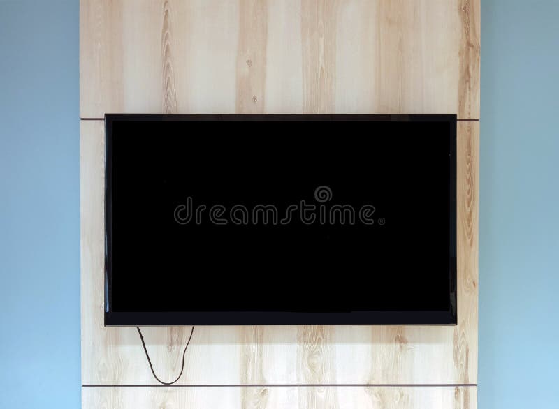 Fermez-vous du poste TV sur le banc ci-dessus de tenture en bois dans le bureau photo libre de droits Fermez-vous du poste TV sur le banc ci-dessus de tenture en bois dans le bureau photo libre de droits