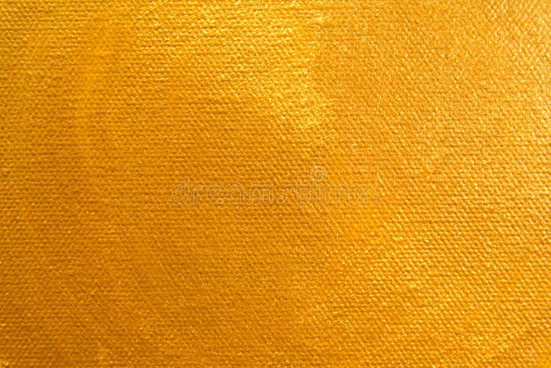 Fermez-vous vers le haut de la peinture de couleur d'or sur la toile de peinture images stock Fermez-vous vers le haut de la peinture de couleur d'or sur la toile de peinture images stock