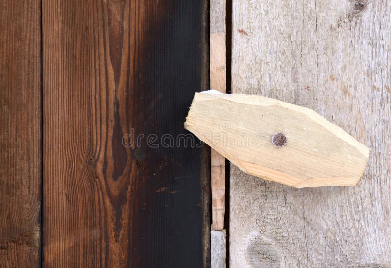 Close-up of the primitive wooden door latch. Close-up of the primitive wooden door latch