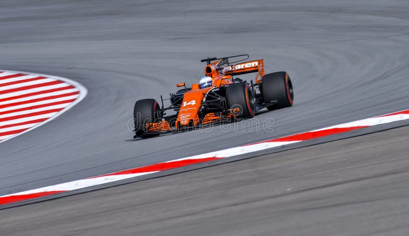 SEPANG, MALAYSIA - SEPTEMBER 30, 2017 : Fernando Alonso of Spain driving the 14 McLaren Honda Formula 1 Team on track during the Malaysia Formula One F1 Grand Prix at Sepang International Circuit. SEPANG, MALAYSIA - SEPTEMBER 30, 2017 : Fernando Alonso of Spain driving the 14 McLaren Honda Formula 1 Team on track during the Malaysia Formula One F1 Grand Prix at Sepang International Circuit