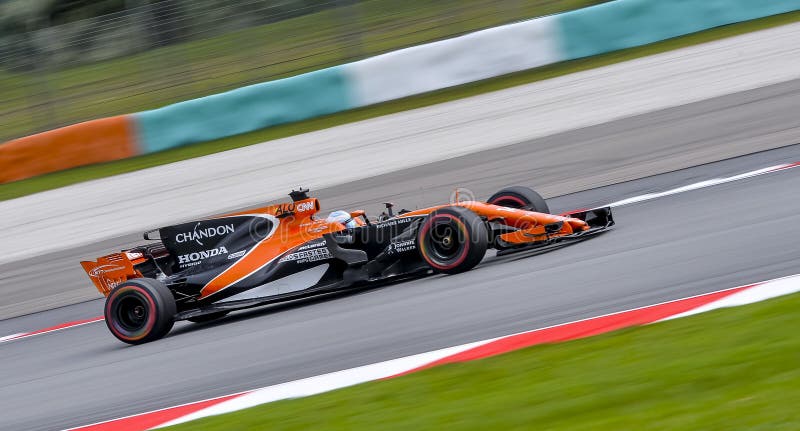 SEPANG, MALAYSIA - SEPTEMBER 29, 2017 : Fernando Alonso of Spain driving the 14 McLaren Honda Formula 1 Team on track during the Malaysia Formula One F1 Grand Prix at Sepang International Circuit. SEPANG, MALAYSIA - SEPTEMBER 29, 2017 : Fernando Alonso of Spain driving the 14 McLaren Honda Formula 1 Team on track during the Malaysia Formula One F1 Grand Prix at Sepang International Circuit