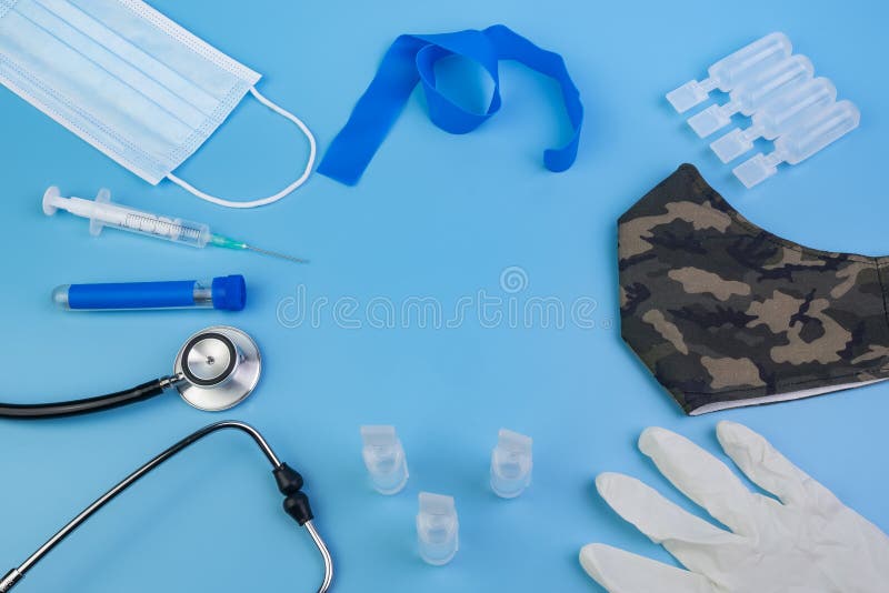 Medical tools and materials on blue background with space for text as concept of medicine, healthcare, hospitals, clinics and research laboratories, against diseases, infections and viruses such as the coronavirus pandemic. Medical tools and materials on blue background with space for text as concept of medicine, healthcare, hospitals, clinics and research laboratories, against diseases, infections and viruses such as the coronavirus pandemic.