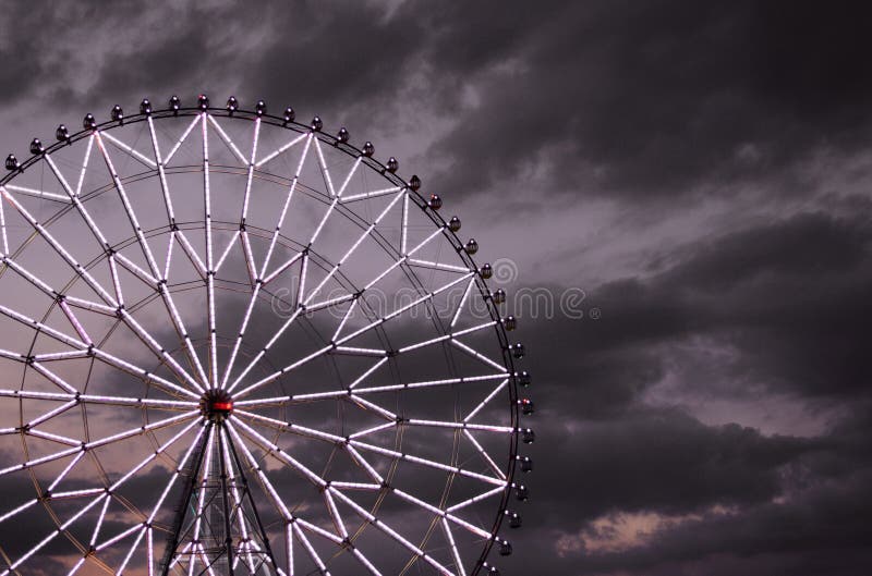 Ferris wheel against the dark sky