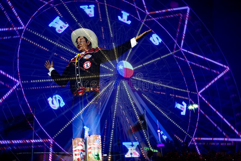 Ferris wheel and Big Tex at State Fair of Texas night