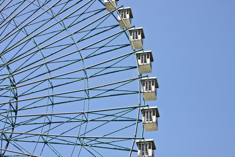 Ferris wheel with blue sky background