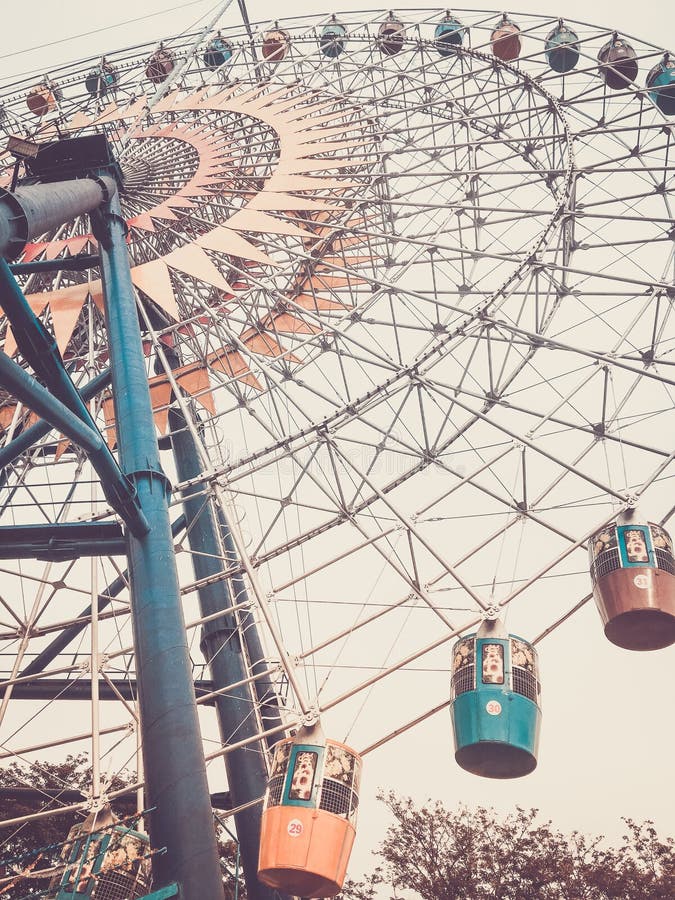 Ferris wheel. Bottom view. Toned vertical image in retro style. royalty free stock photos Ferris wheel. Bottom view. Toned vertical image in retro style. royalty free stock photos