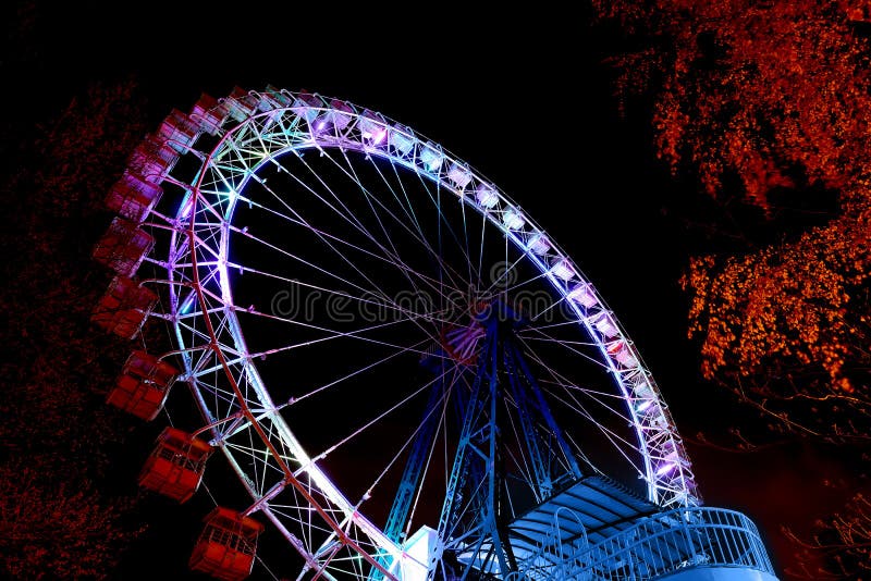 Ferris wheel with color lighting in funfair at night stock photography Ferris wheel with color lighting in funfair at night stock photography