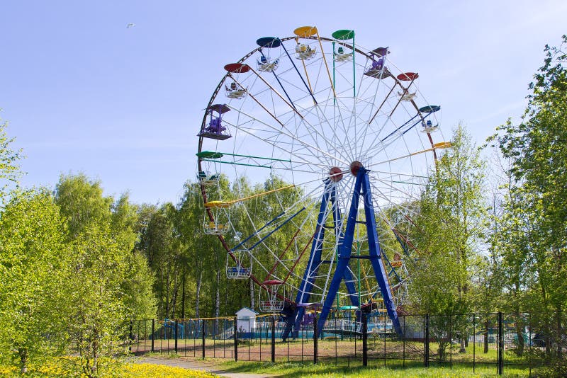 Ferris wheel in sunny summer day against clear blue sky royalty free stock photos Ferris wheel in sunny summer day against clear blue sky royalty free stock photos