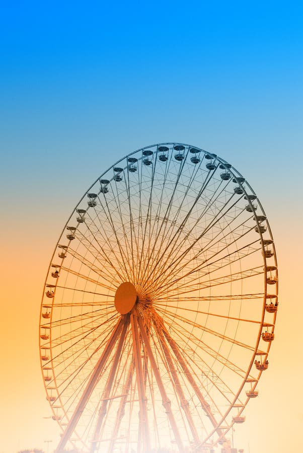 Ferris wheel at sunset.