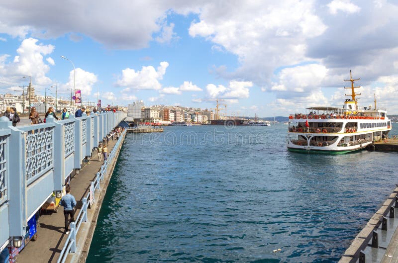 A ferry boat cruises from the Bosphorus River Bridge on the Golden Horn with the Galata Tower and Istanbul Turkey in view royalty free stock images A ferry boat cruises from the Bosphorus River Bridge on the Golden Horn with the Galata Tower and Istanbul Turkey in view royalty free stock images