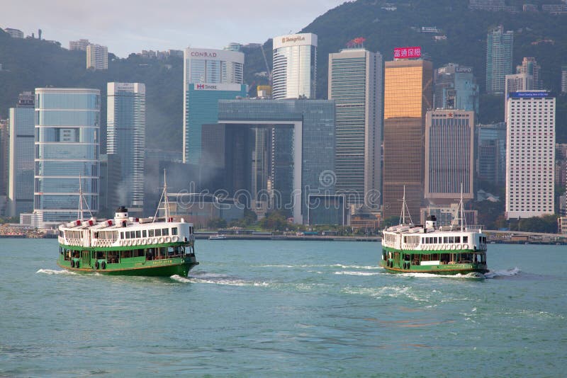 HONG KONG - APRIL 2: Ferry \"Day star\" cruising Victoria harbor on April 2, 2017 in Hong Kong, China. Hong Kong ferry is in operation for more than 120 years and is one of main attractions of the city. HONG KONG - APRIL 2: Ferry \"Day star\" cruising Victoria harbor on April 2, 2017 in Hong Kong, China. Hong Kong ferry is in operation for more than 120 years and is one of main attractions of the city