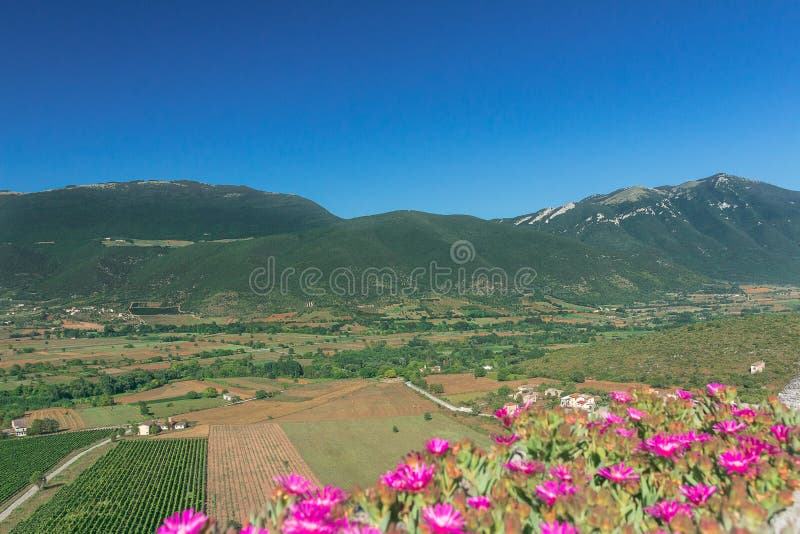 Fertile rural green valley landscape with mountains in Italian Abruzzo region. Fertile rural green valley landscape with mountains in Italian Abruzzo region