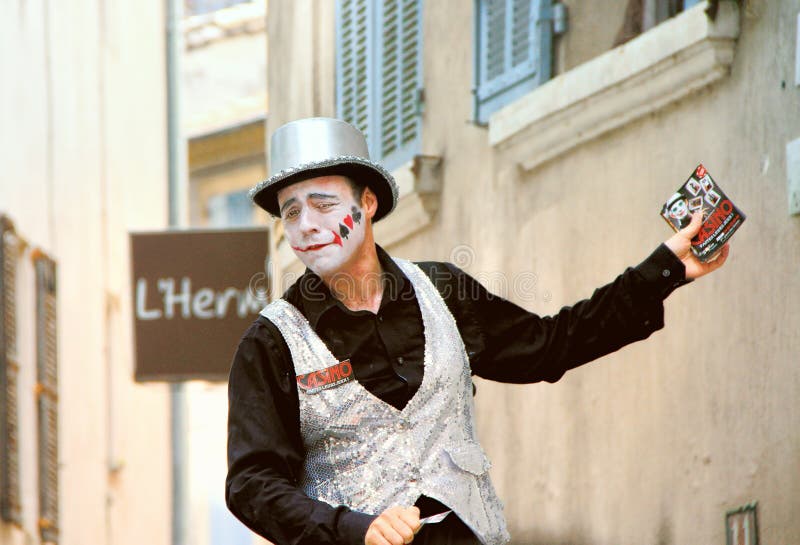 AVIGNON, FRANCE – JULY 19, 2014: Actor in historical costume advertising his performanceduring famous theatre festival from July 4 to 27, 2014 in Avignon, south of France. The Avignon Festival is today one of the most important contemporary performing arts events in the world. AVIGNON, FRANCE – JULY 19, 2014: Actor in historical costume advertising his performanceduring famous theatre festival from July 4 to 27, 2014 in Avignon, south of France. The Avignon Festival is today one of the most important contemporary performing arts events in the world