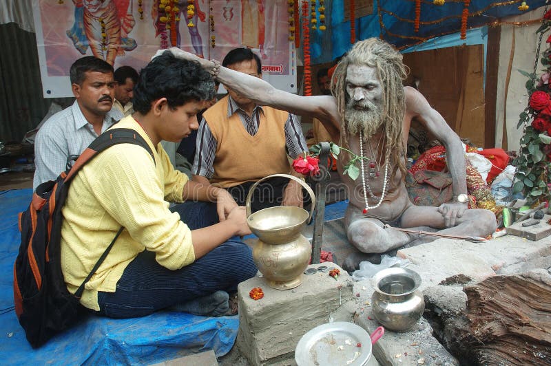 January 14, 2009-DURING THE FAIR,IN THE ASCETICS STALL-PEOPLE ARE VISIT TO THOSE SAINT’S FOR THEIR EXPECTATION AND SAINT’S EARN MUCH MONEY IN THIS PROCESS. Gangasagar Mela is the largest fair, celebrated in West Bengal (INDIA). This fair is held where the Ganga river and the Bay of Bengal form a nexus. January 14, 2009-DURING THE FAIR,IN THE ASCETICS STALL-PEOPLE ARE VISIT TO THOSE SAINT’S FOR THEIR EXPECTATION AND SAINT’S EARN MUCH MONEY IN THIS PROCESS. Gangasagar Mela is the largest fair, celebrated in West Bengal (INDIA). This fair is held where the Ganga river and the Bay of Bengal form a nexus.