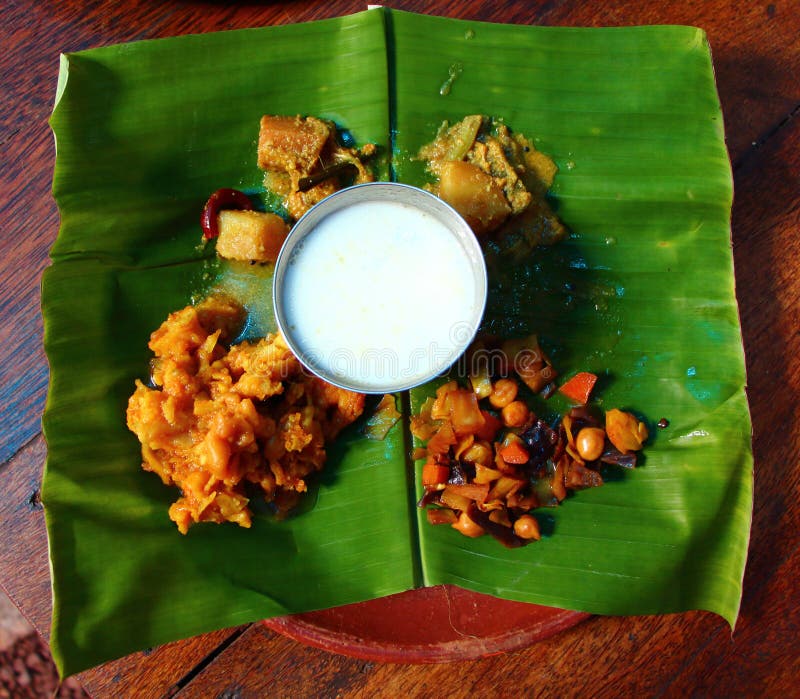 Festival food on banana leaf. Rice ingridients. India stock photos Festival food on banana leaf. Rice ingridients. India stock photos