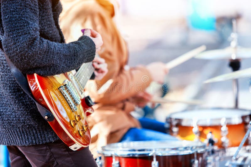 Festival music band. Friends playing on percussion instruments city park.