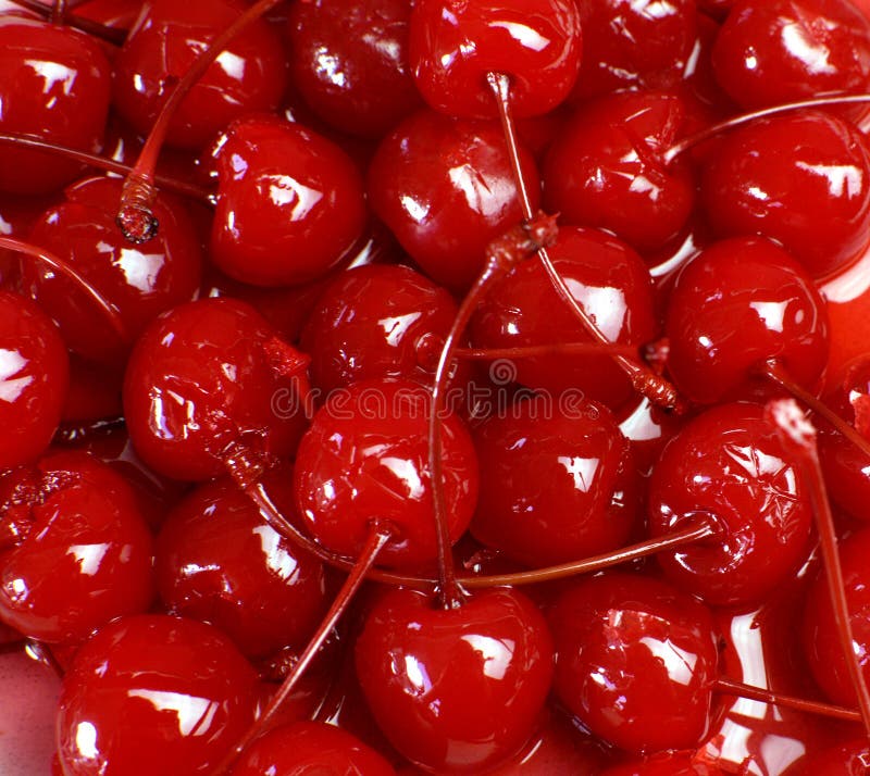 Festive background of red cocktail maraschino cherries