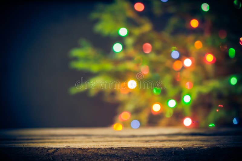 Festive background wooden table Christmas tree lights