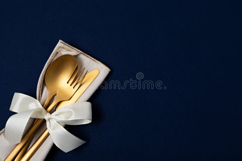 Festive christmas, wedding, birthday table setting with golden cutlery. Mockup for place card, dinner invitation