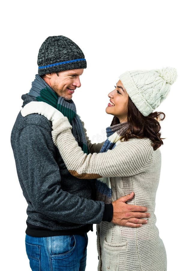 Festive couple in winter clothes on white background. Winter woolen clothes stock images, royalty-free photos and pictures