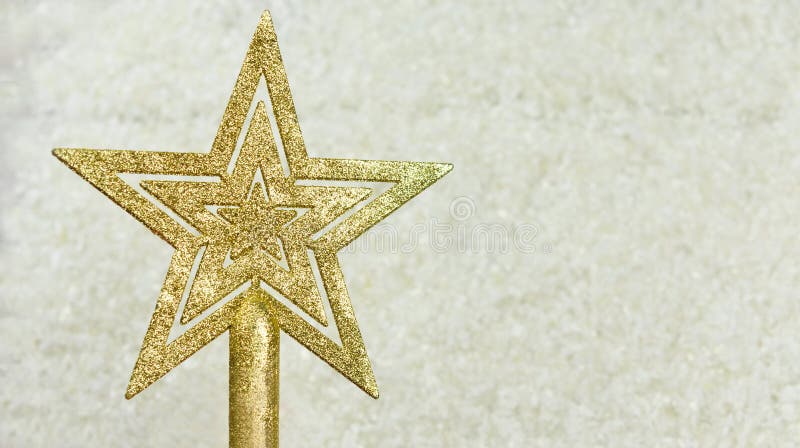 Festive decoration toy on the Christmas tree golden star