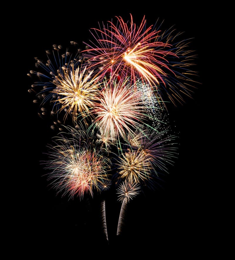 Festive fireworks display lit up over night sky stock image