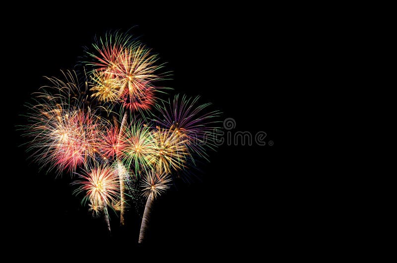 Festive fireworks display lit up over night sky royalty free stock photo